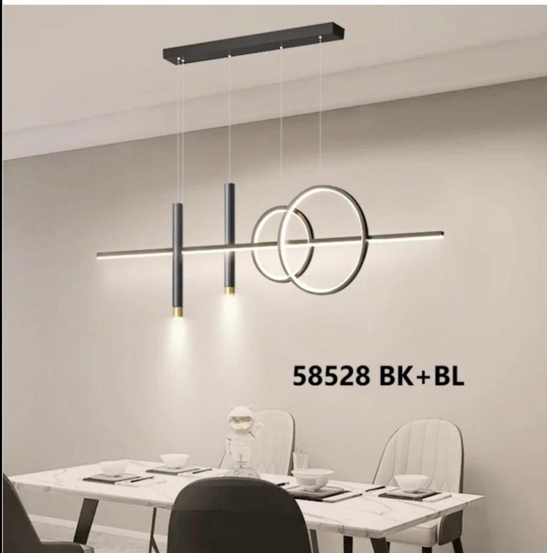 Black linear pendant light with dual ring accents over a dining table